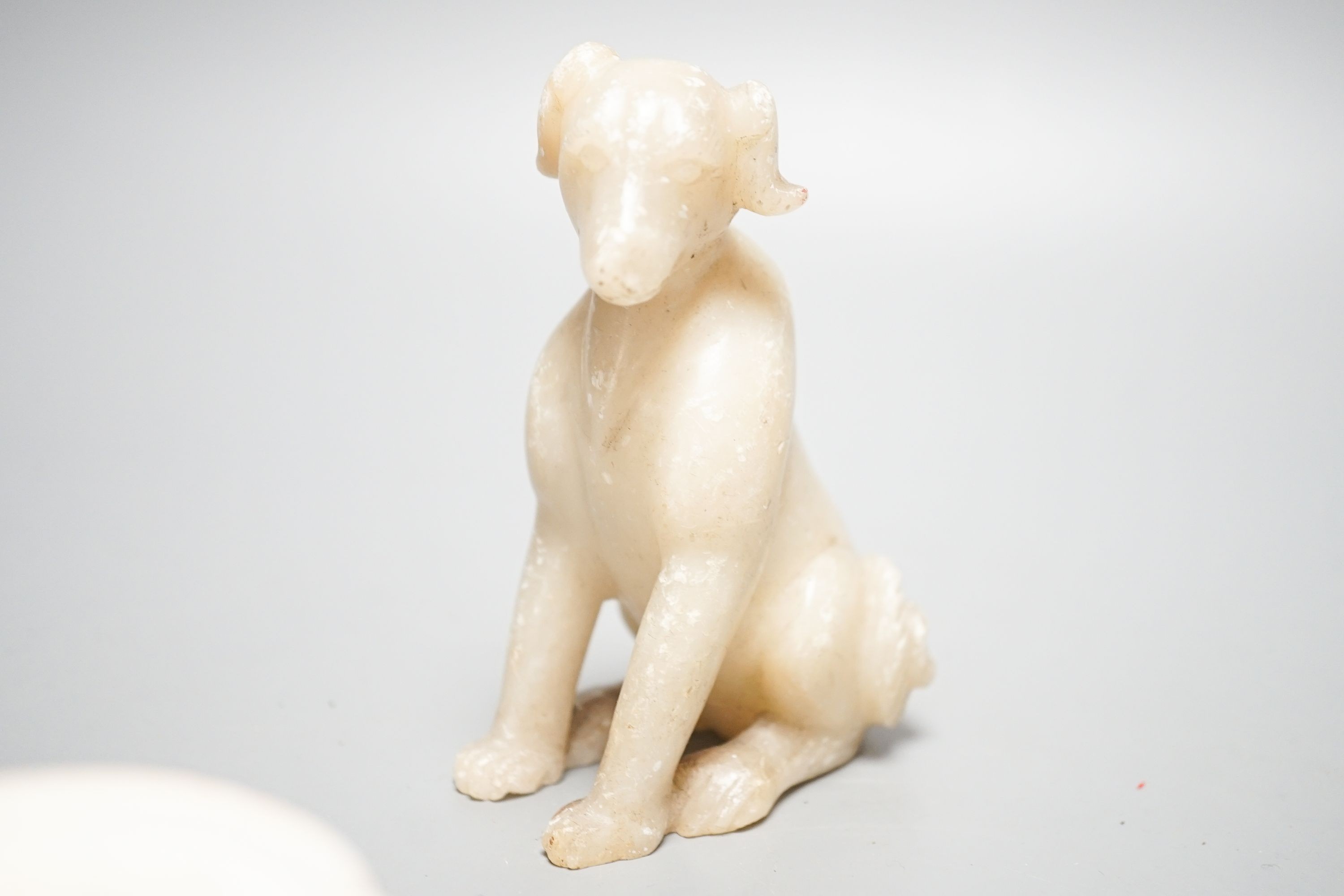 Two Chinese Qingbai bowls, probably Song Dynasty, largest 13, cm and a Chinese soapstone figure of a seated dog, 10.5cm (3)